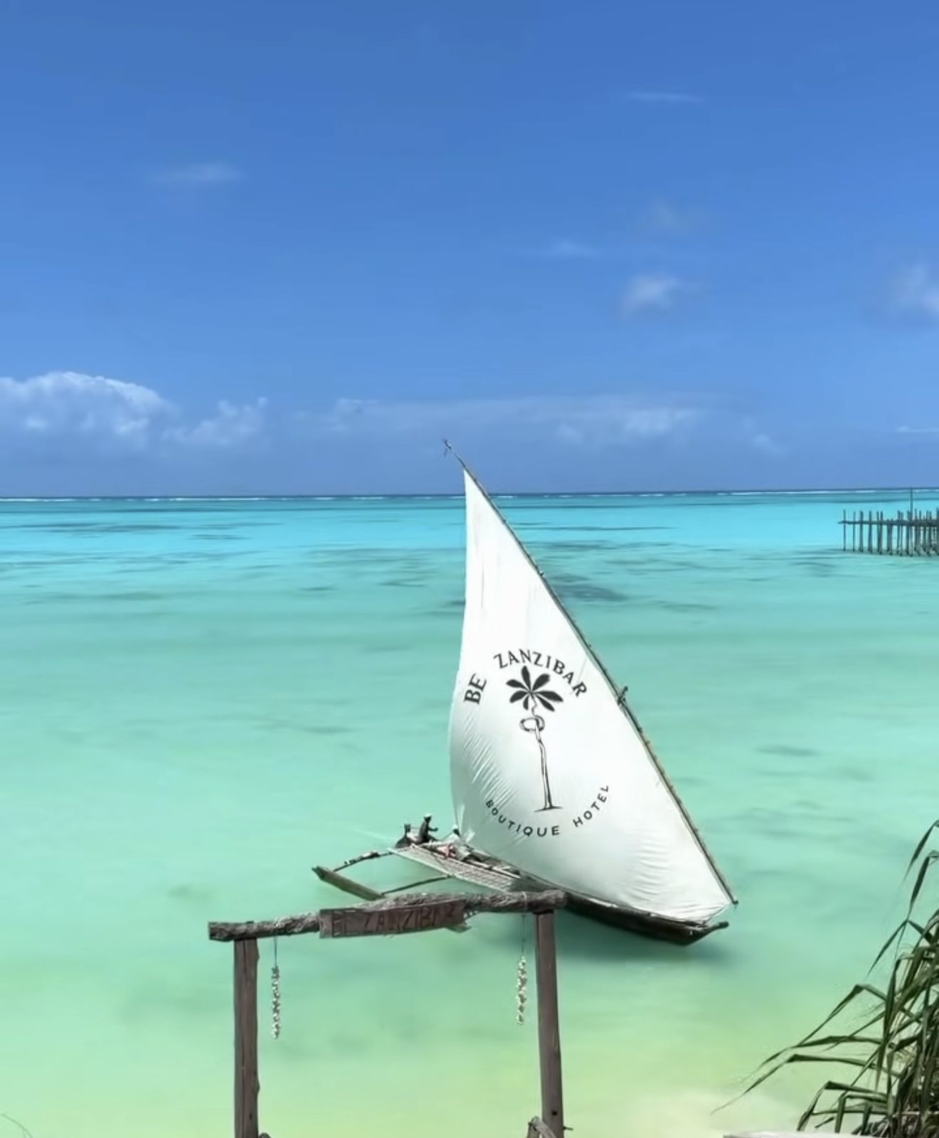 Traditional dhow sailing on turquoise water in Zanzibar